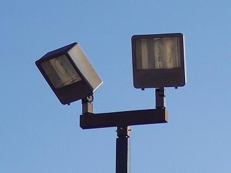 Commercial parking lot with LED pole lights illuminating the area at night