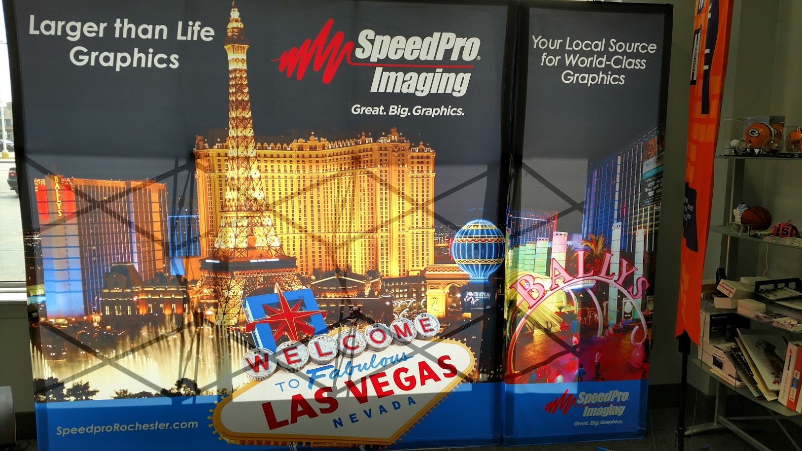 Professional trade show booth display with custom banners and signage at a convention